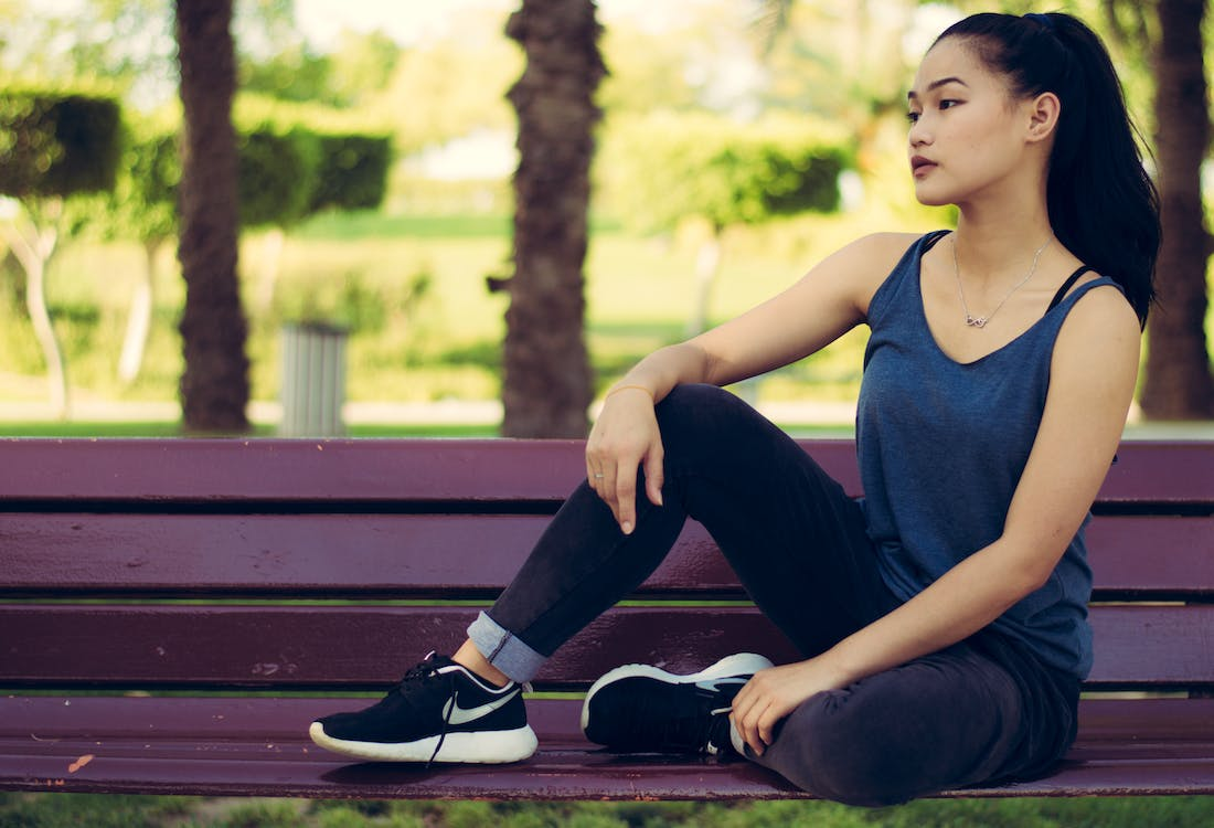 a woman wearing Nike trainers