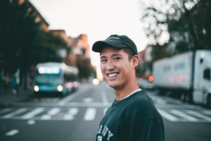 an Asian consumer posing on the street