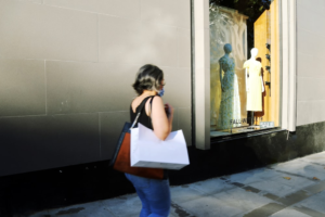 a Hispanic woman going to shop at a store